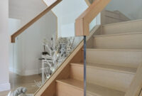 A Contemporary Oak And Glass Staircase With A Galleried