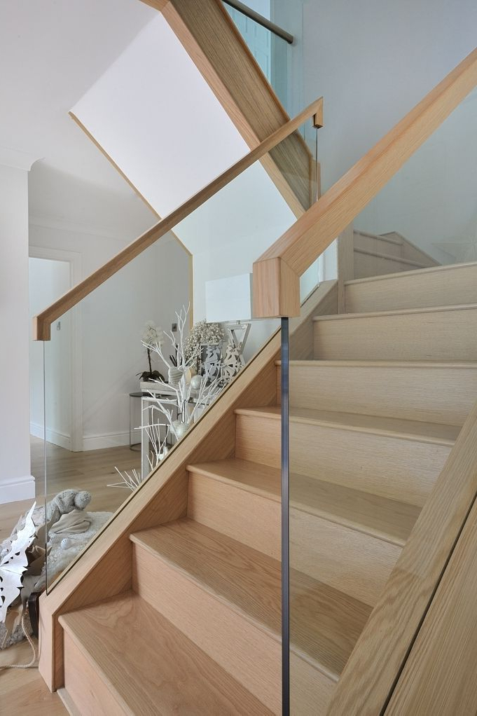 A Contemporary Oak And Glass Staircase With A Galleried