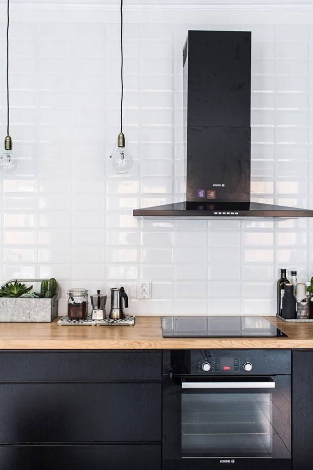 Black Kitchen Cabinets White Tiles And Wood Work Top In A Home In Helsinki Finland My