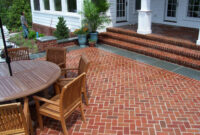 Brick Pavers In A Herringbone Pattern Set With A Flamed