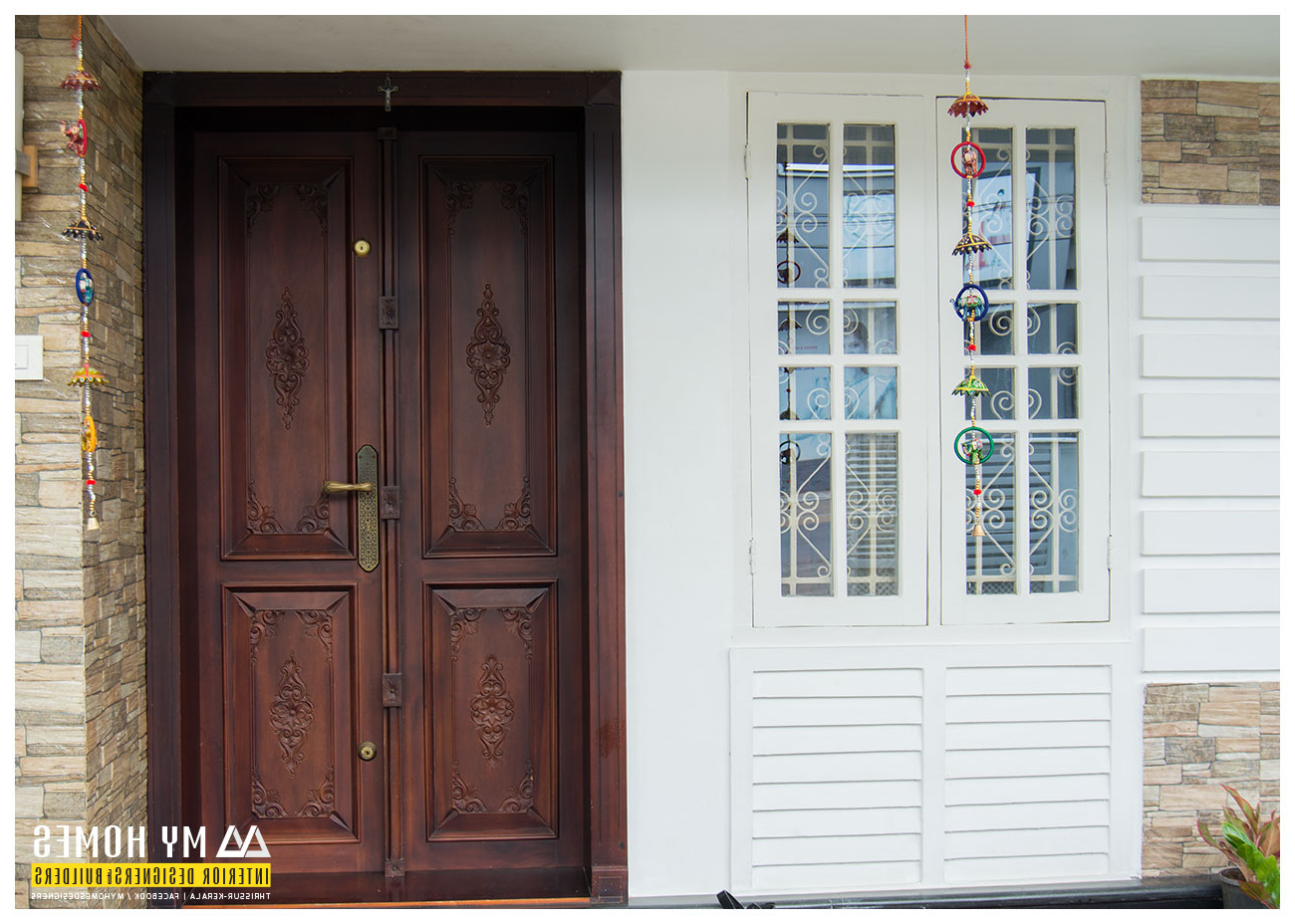 Delicate Front Wooden Door Designs Kerala