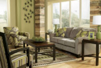 Earth Tone Living Room With Green Wall Paint And Gray Sofa