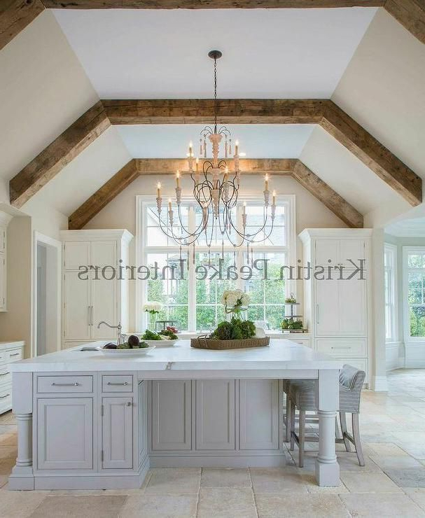 Elegant Kitchen With Vaulted Ceilings Lined With Rustic