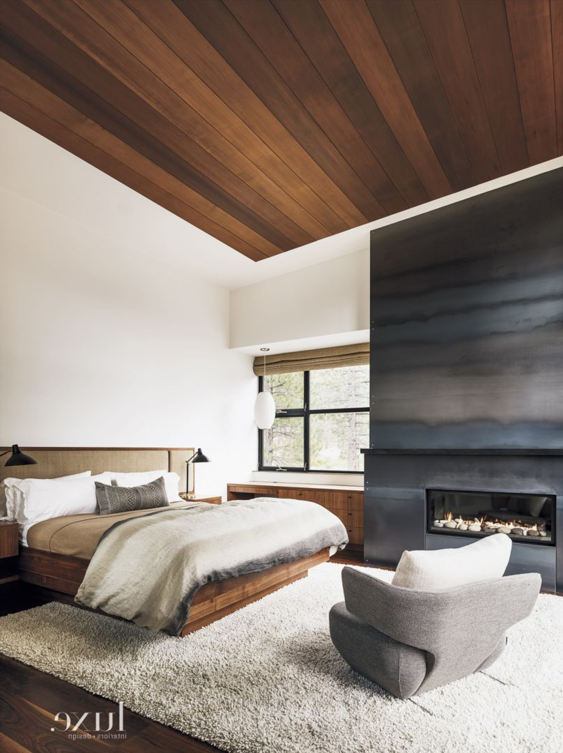 Masculine Master Bedroom With Wood Ceiling And Sleek