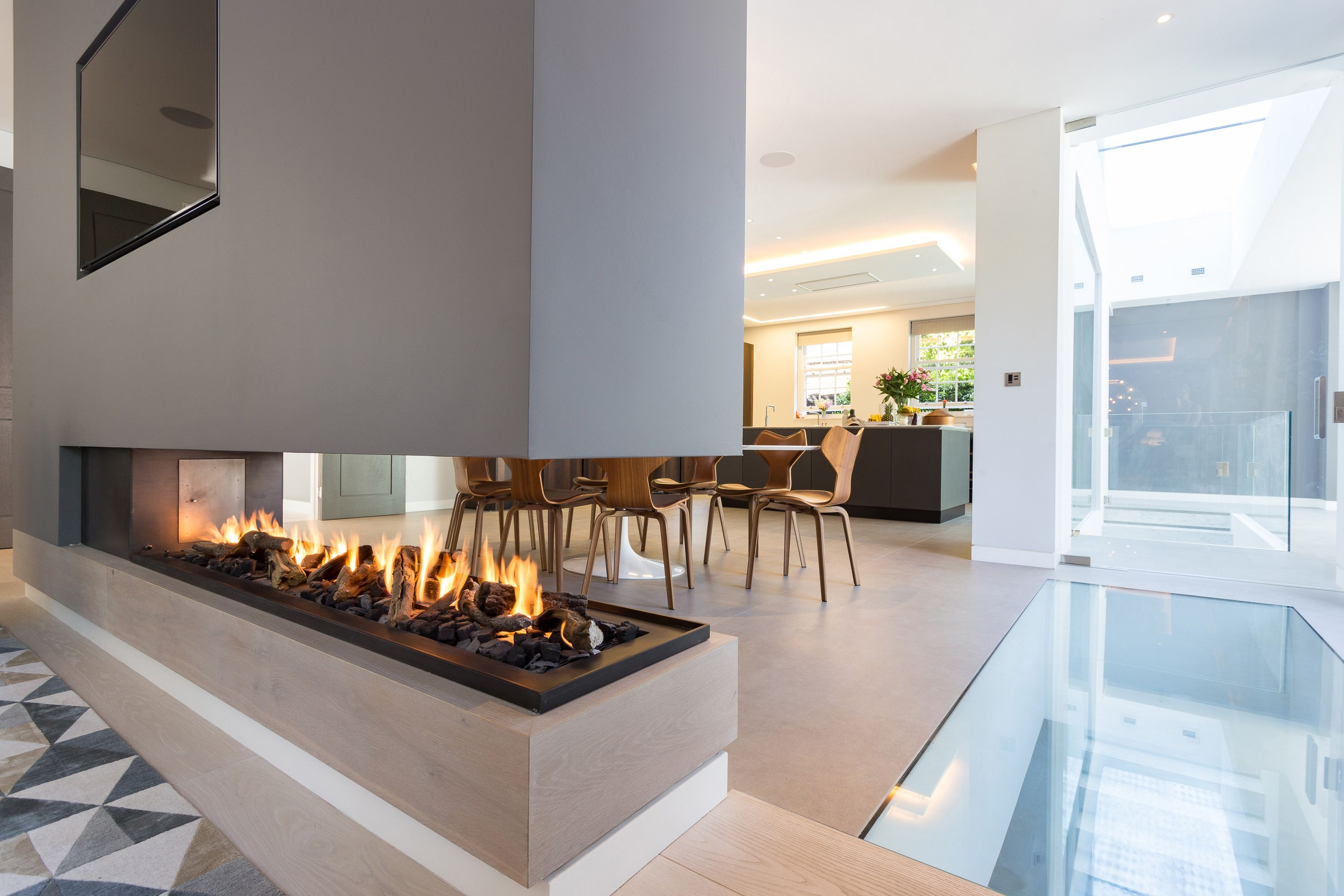 This Stunning Three Sided Gas Fireplace Forms Part Of A