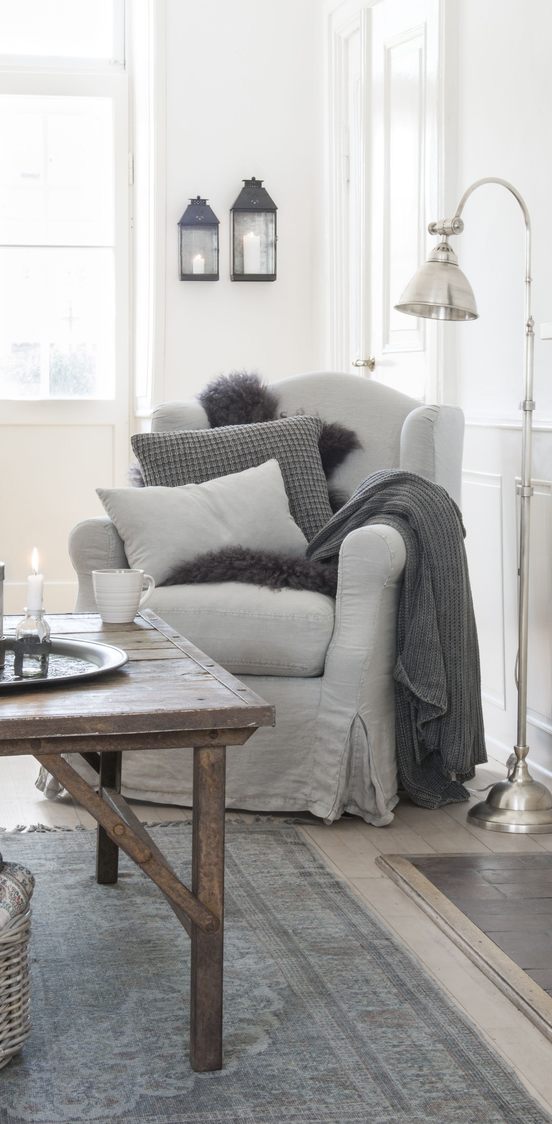 White Sitting Room With Gray Furniture Throw Blankets