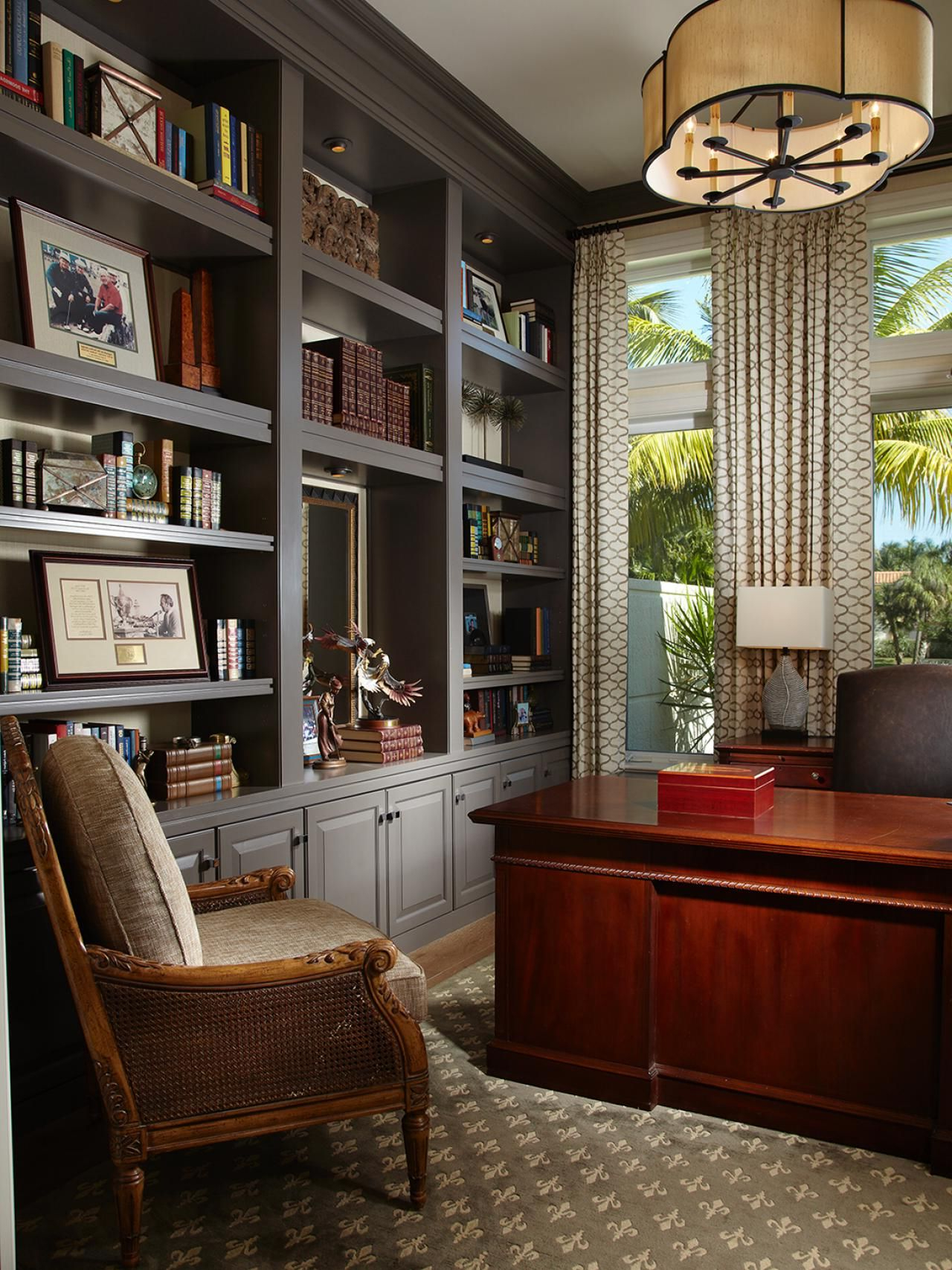 With A Glossy Mahogany Desk And Expansive Gray Built Ins